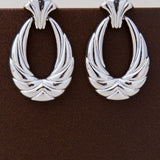 Pendiente aro ovalado labrado con relieve Plata